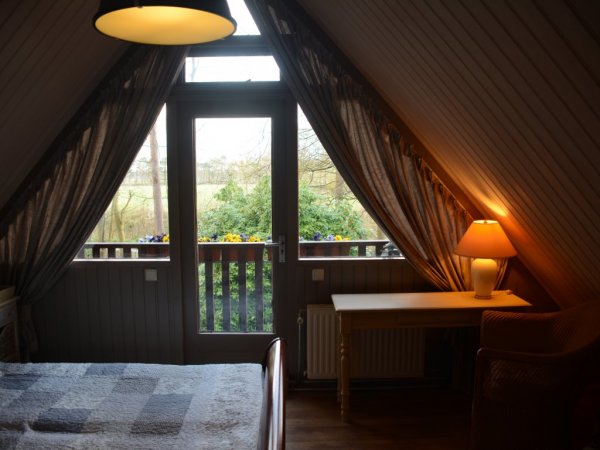 Slaapkamer boven met balkon